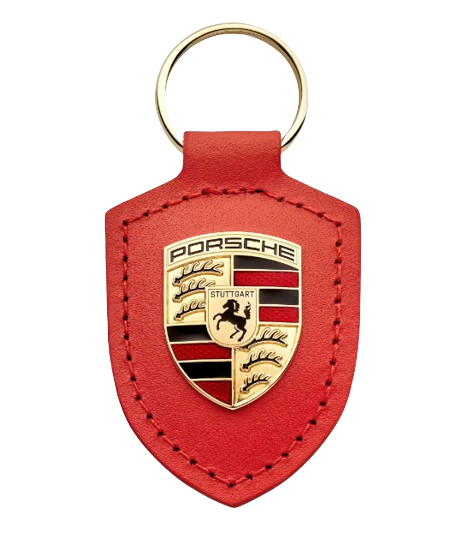 Porsche Schlüsselanhänger Wappen „Driven by Dreams“ – 75Y Lavaorange