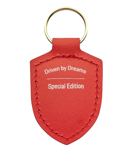 Original Porsche Schlüsselanhänger Wappen „Driven by Dreams“ – 75Y Lavaorange Logo Emblem 